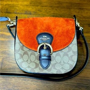Coach purse. Very good during fall . Used it once. Cleaning out closet